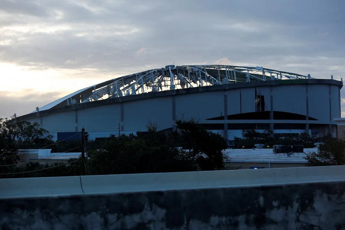 View of the damaged roof of Tropicana Field stadium, the home of Major League Baseball's Tampa Bay Rays, after Hurricane Milton made landfall, in downtown St. Petersburg, Florida, U.S. October 10, 2024.  REUTERS/Octavio Jones
