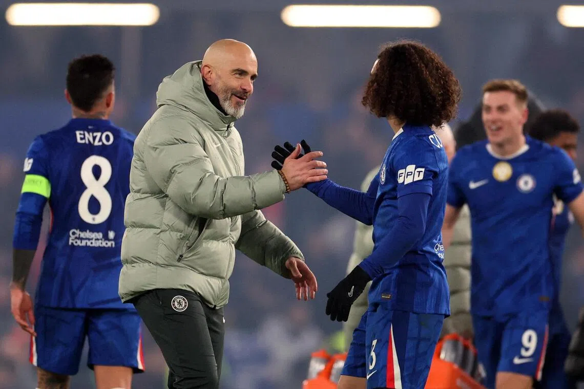 Chelsea manager Enzo Maresca shaking hands with Marc Cucurella after the match.