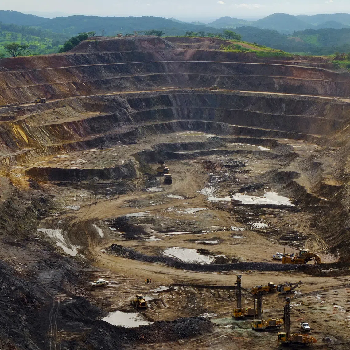 FILE PHOTO: Excavators and drillers at work in an open pit at Tenke Fungurume, a copper and cobalt mine, northwest of Lubumbashi in Congo's copper-producing south, January 29, 2013. REUTERS/Jonny Hogg/File Photo