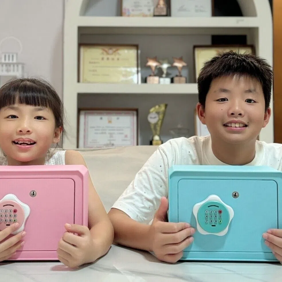 Siblings Oscar, 11, and Olivia, 9, are learning to manage their own allowance. Their parents Thomas Woo and Candy Meng encourage the children to save about 10 to 20 per cent of their allowance in their piggy banks.