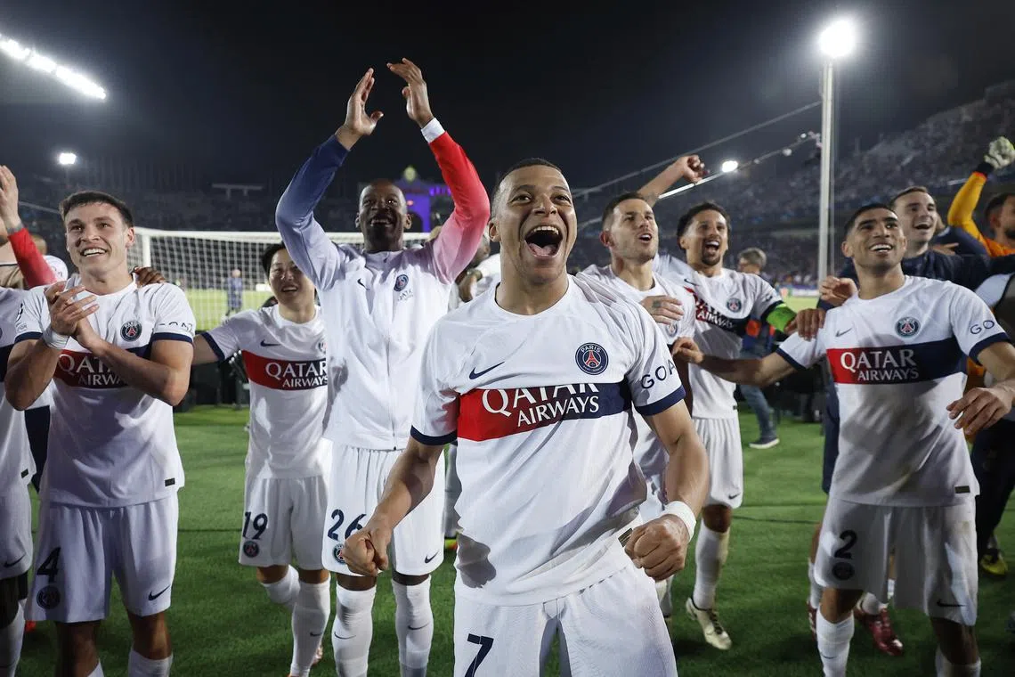 Soccer Football - Champions League - Quarter Final - Second Leg - FC Barcelona v Paris St Germain - Estadi Olimpic Lluis Companys, Barcelona, Spain - April 16, 2024 Paris St Germain's Kylian Mbappe with teammates celebrate after the match REUTERS/Juan Medina
