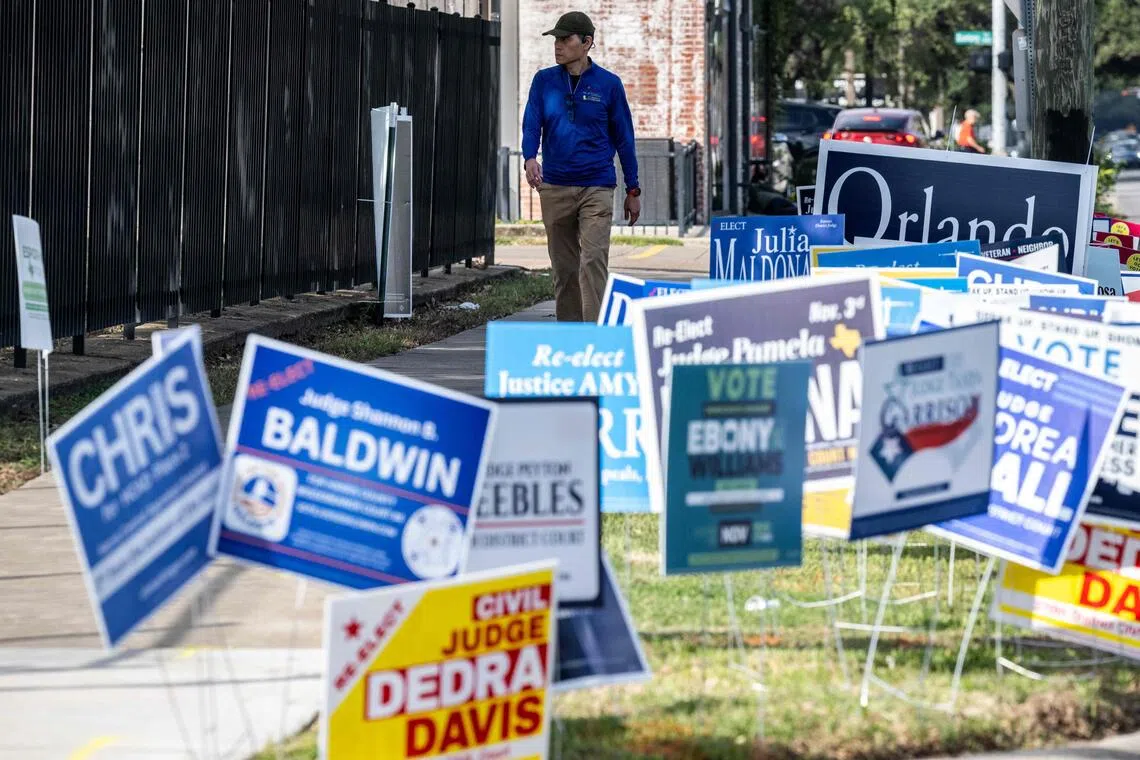 A man arrives at a polling location on the first day of early voting in Texas for the midterm elections.