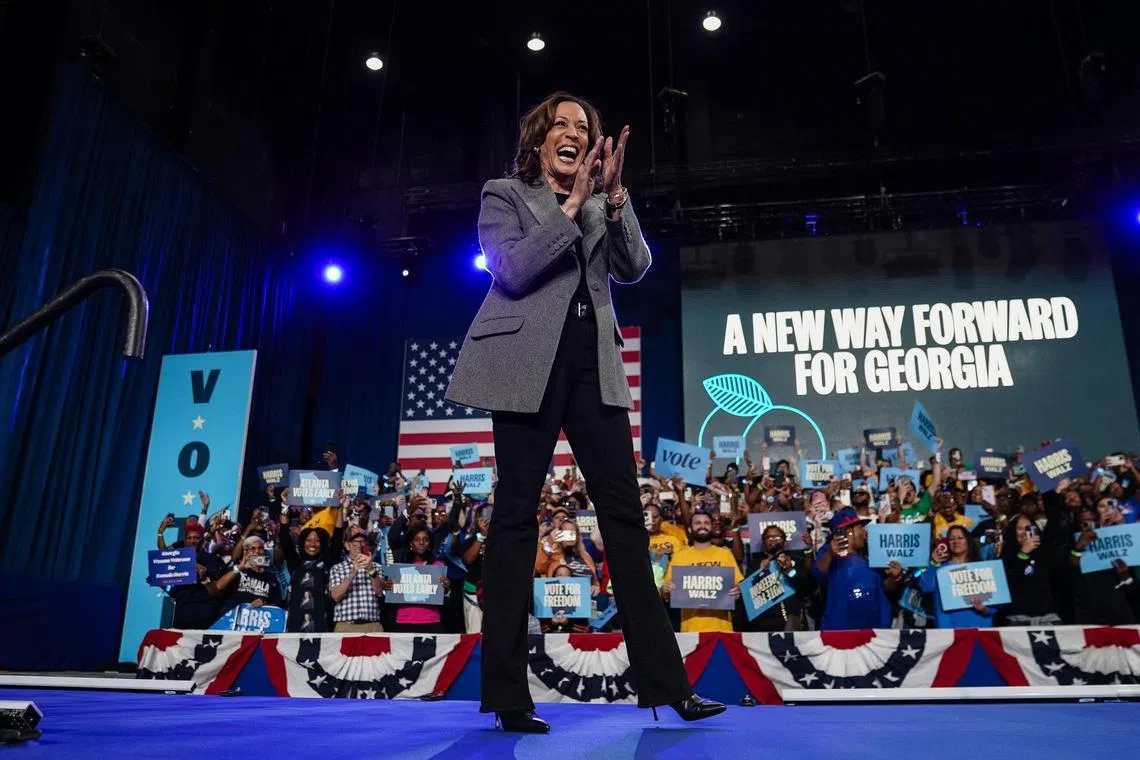 Democratic presidential nominee, Vice President Kamala Harris, waves to the crowd before speaking at a campaign rally encouraging early voting on October 19, 2024 in Atlanta, Georgia. 