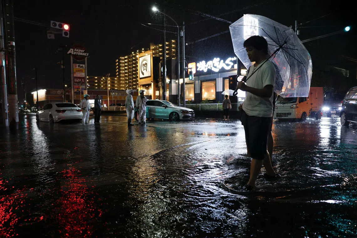 Thousands stranded at Japan’s Narita airport after record rain kills four