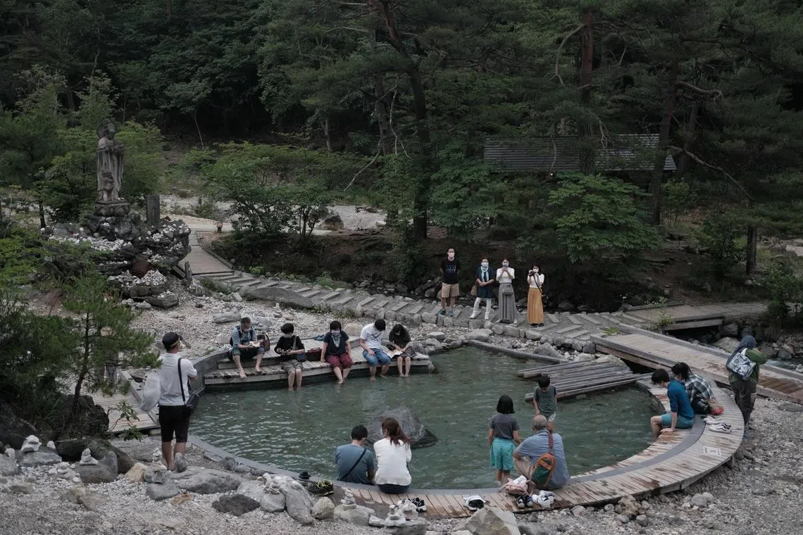 People at a public footbath in Kusatsu in Japan's central Gunma prefecture.