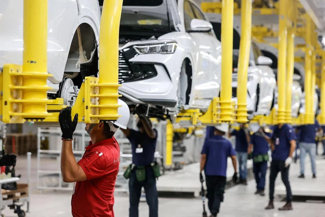 Electric vehicles being assembled at Chinese automaker BYD’s new factory in Bahia, Brazil. 