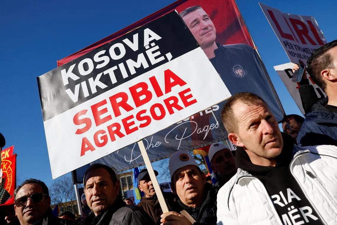 FILE PHOTO: Supporters of former Kosovo President Hashim Thaci protest on the first day of his war crimes trial in The Hague, Netherlands, April 3, 2023. REUTERS/Piroschka van de Wouw/File Photo