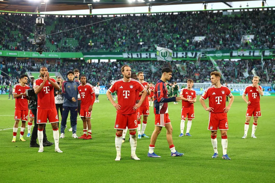 Soccer Football - Bundesliga - VfL Wolfsburg v Bayern Munich - Volkswagen Arena, Wolfsburg, Germany - May 9, 2026 Bayern Munich's Harry Kane, Jonathan Tah and Joshua Kimmich celebrate after the match REUTERS/Lisi Niesner