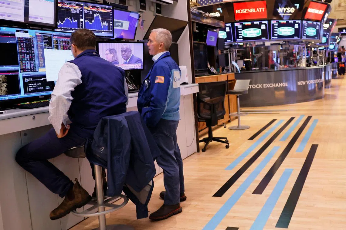 Traders work on the floor of the New York Stock Exchange, in New York City. 
