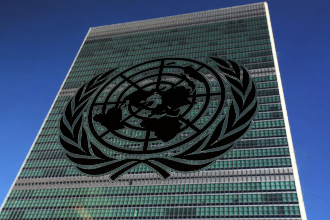 The United Nations logo is pictured in front of the United Nations Headquarters building during the 71st United Nations General Assembly in the Manhattan borough of New York, U.S., September 22, 2016. REUTERS/Carlo Allegri