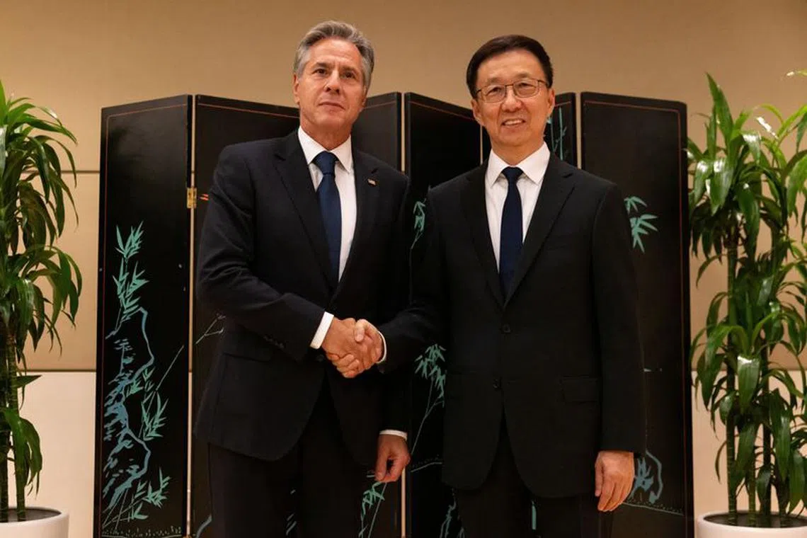 Secretary of State Antony Blinken and Chinese Vice President Han Zheng shake hands while posing for photos, Monday, Sept. 18, 2023, in New York, U.S.     Julia Nikhinson/Pool via REUTERS