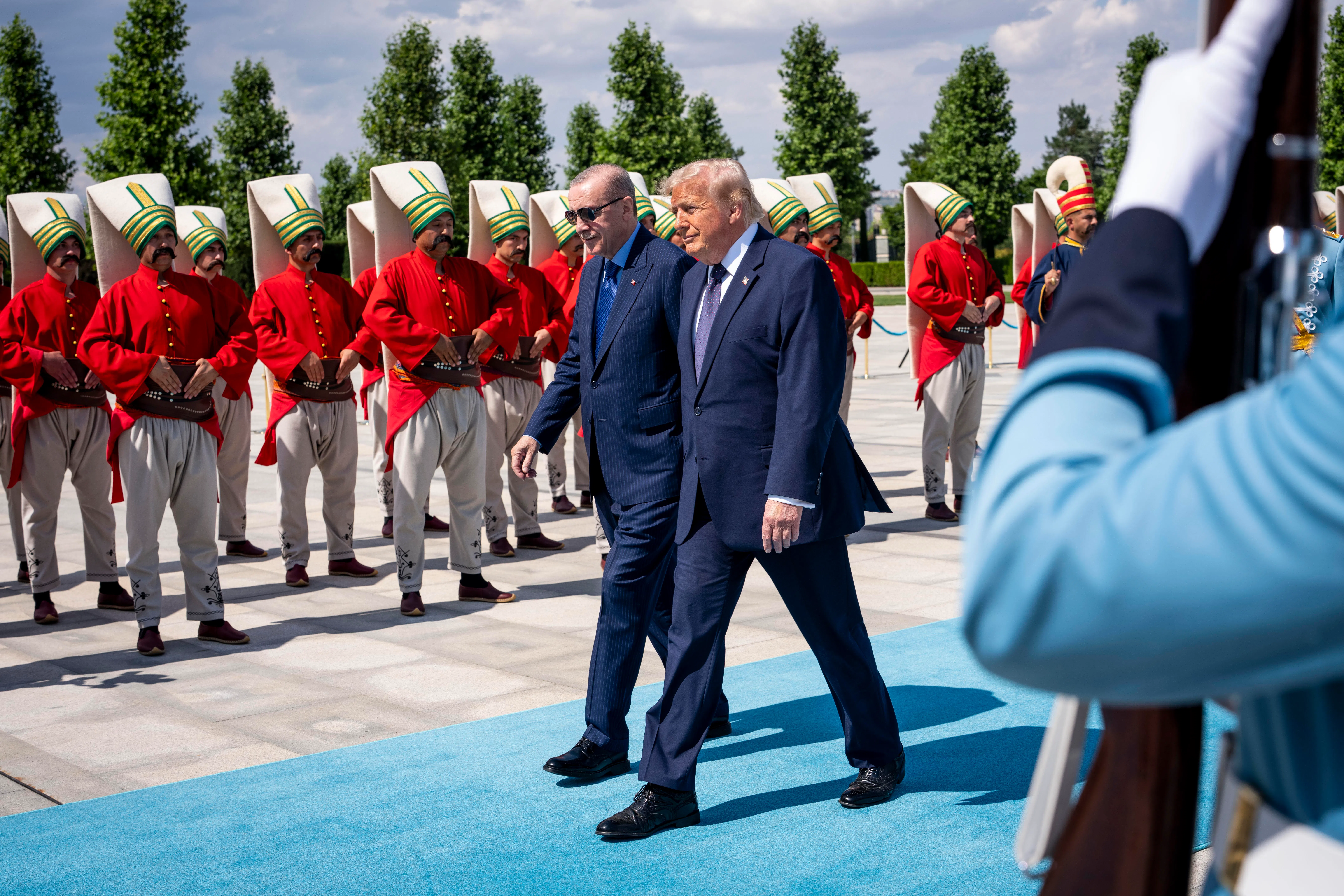 President Donald Trump, right, is escorted by President Recep Tayyip Erdogan of Turkey during an arrival ceremony ahead of the NATO Summit in Ankara, Turkey, on Tuesday, July 7, 2026. The two-day meeting of NATO leaders, which ended on Wednesday, was a tale of two summits. (Doug Mills/The New York Times)