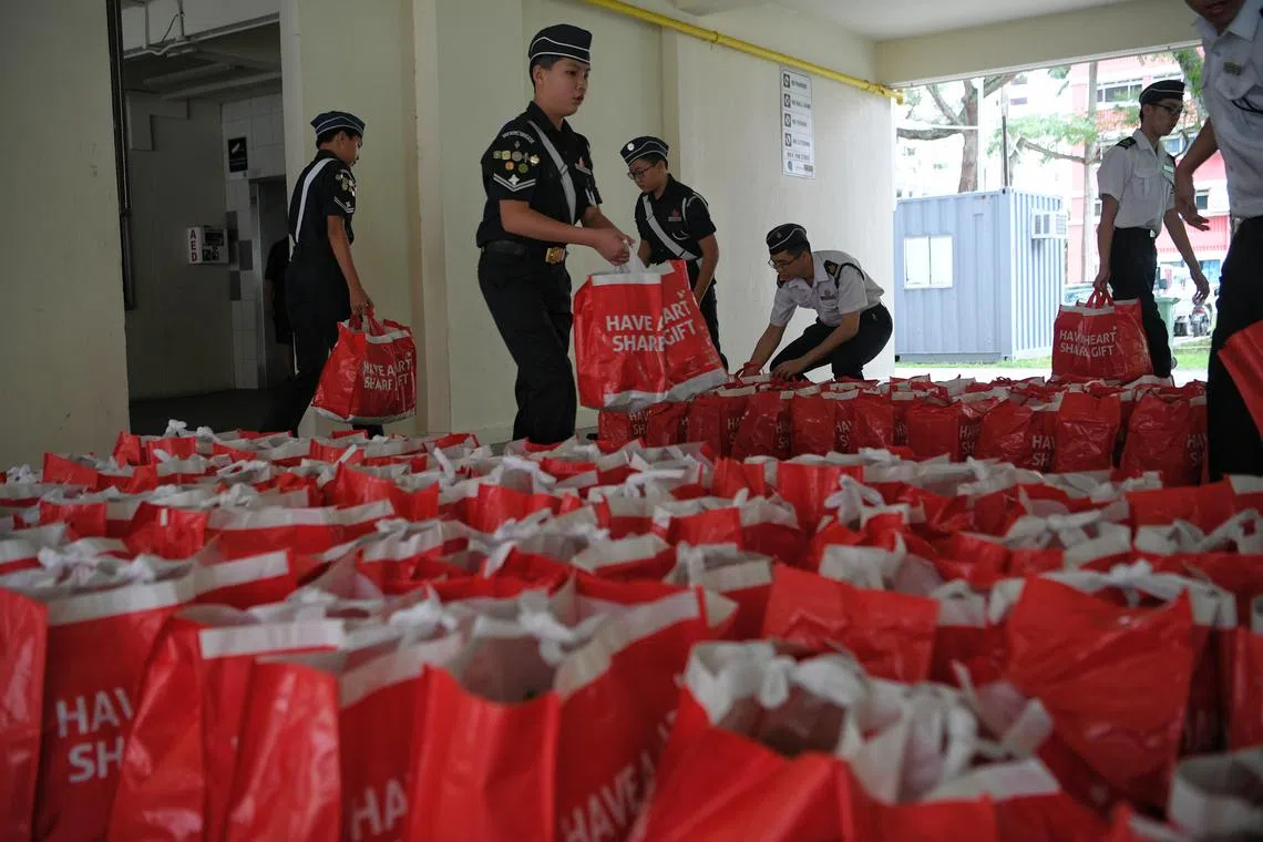 BB Boys delivering food hampers to beneficiaries in the Redhill neighbourhood during the Boys’ Brigade Share-A-Gift 2019 closing event held on 18 December, 2019.