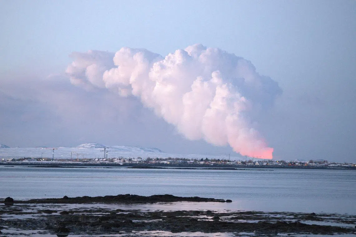 A volcanic eruption is seen in the distance from the Icelandic capital of Reykjavik, Iceland, on Feb 8, 2024. 