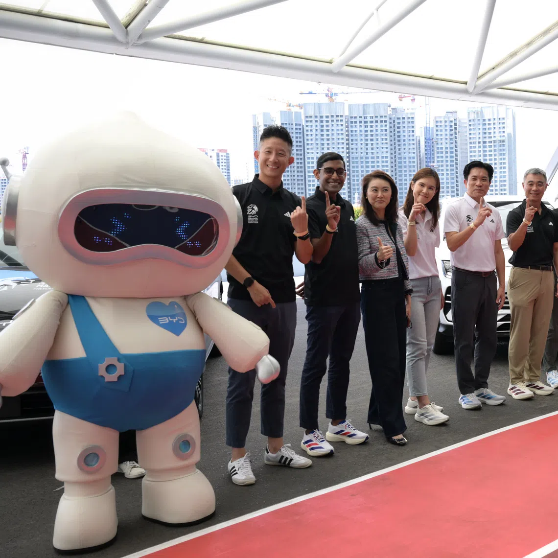 James Ng (fifth from left), managing director of BYD Singapore and president of BYD Philippines, at the March 17 launch of the Dec 4-6 BYD Singapore International Marathon at the National Stadium.