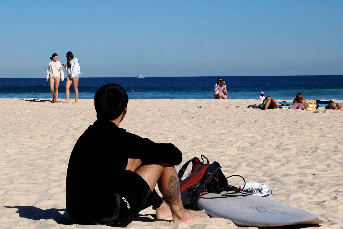 Sun, surf and a shorter stay: Backpackers fret over Australia’s visa crackdown