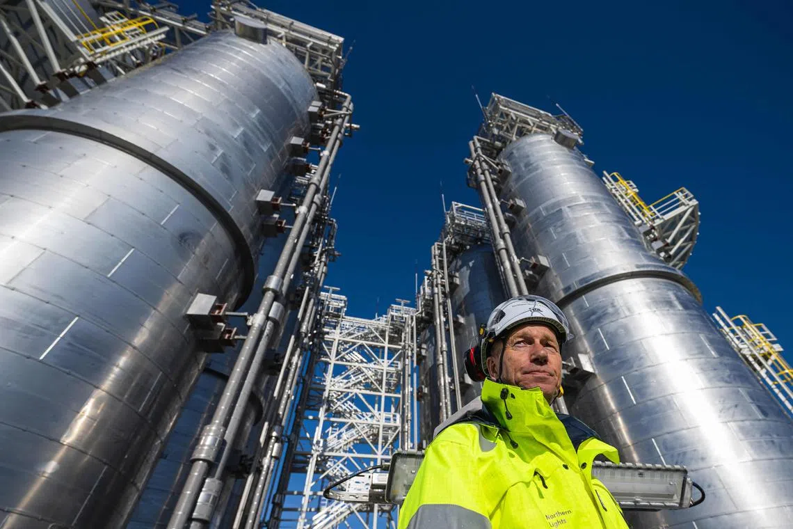 Norway’s Minister of Energy, Terje Aasland visits the Northern Lights, a CO2 transport and storage facility on September 26, 2024 in Oygarden, near Bergen, Norway. Norway is set to inaugurate on September 26, 2024 the gateway to a massive undersea vault for carbon dioxide, a crucial step before opening what its operator calls the first commercial service offering CO2 transport and storage. The Northern Lights project plans to take CO2 emissions captured at factory smokestacks in Europe and inject them into geological reservoirs under the seabed. (Photo by Jonathan NACKSTRAND / AFP)