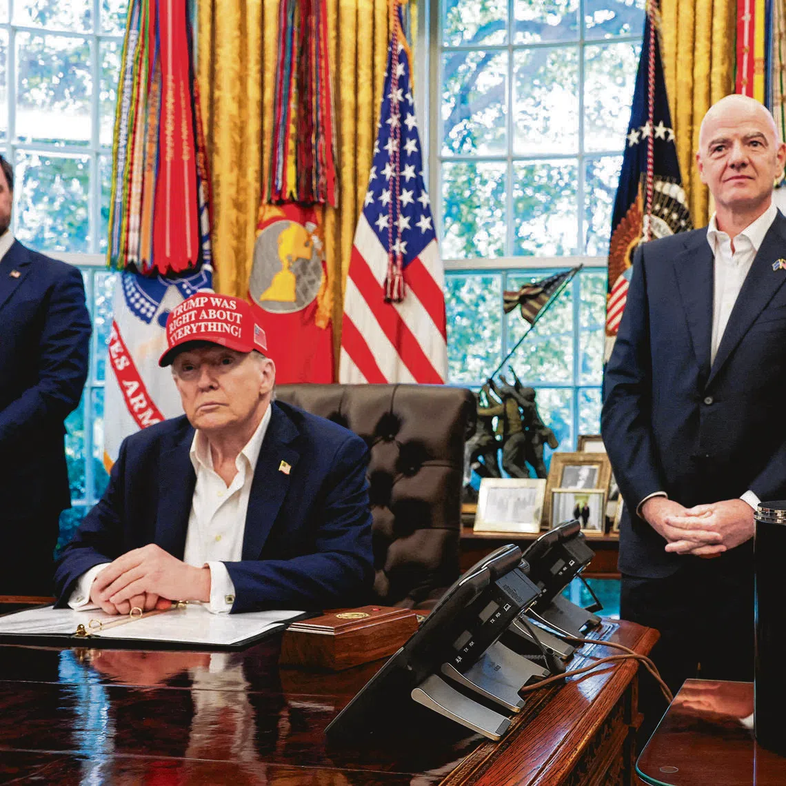 (From left) U.S. President Donald Trump sits near the FIFA World Cup Trophy, as FIFA president Gianni Infantino and U.S. Homeland Security Secretary Kristi Noem stand, in the Oval Office at the White House on Aug 22, 2025.