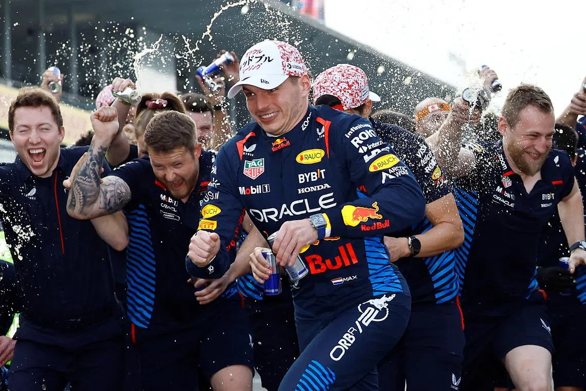 Formula One F1 - Japanese Grand Prix - Suzuka Circuit, Suzuka, Japan - April 7, 2024 Red Bull's Max Verstappen celebrates with his team after winning the Japanese Grand Prix REUTERS/Issei Kato     TPX IMAGES OF THE DAY