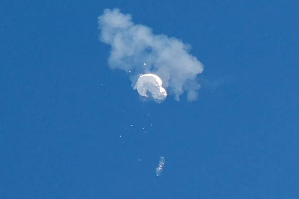 The suspected Chinese spy balloon drifts to the ocean after being shot down off the coast in Surfside Beach, South Carolina. 