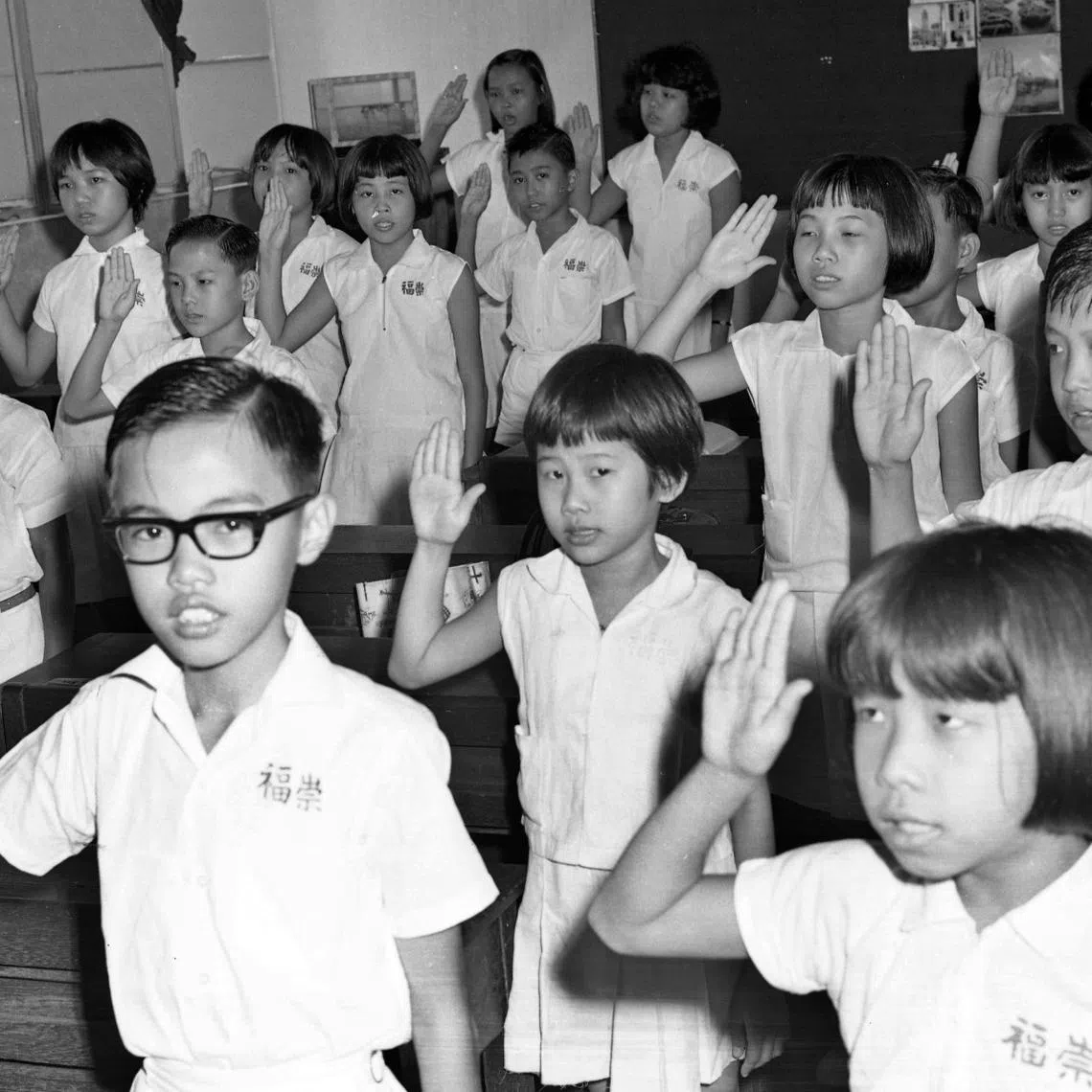 Chongfu School pupils reciting the pledge on Aug 25, 1966, a day after it was recited for the first time by students in all government and aided schools.
