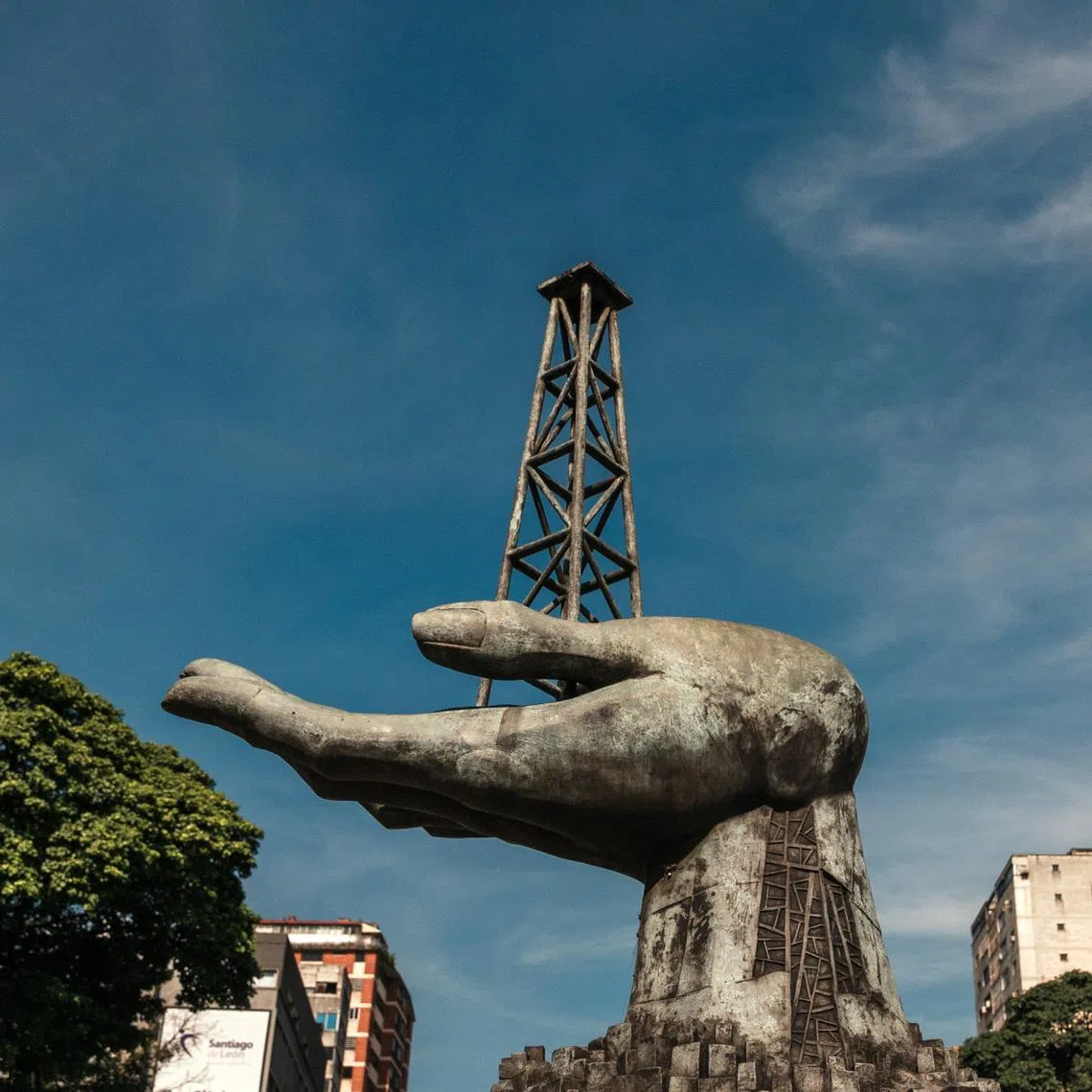 A statue of a hand holding a drilling rig near the headquarters of PDVSA, Venezuela's state oil company, in Caracas.