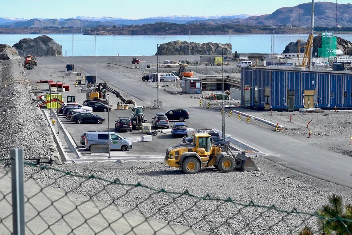 (FILES) This file photo taken on April 24, 2022 in Oygarden near Bergen, Norway, shows the construction site for a terminal which will collect liquefied carbon dioxide CO2, which will arrive by ship from industrial facilities in Europe and will run through a pipeline into geological formations deep beneath the sea bed, so that it does not contribute to global warming. - Denmark on March 8, 2023 inaugurates a project to store carbon dioxide 1,800 meters below the North Sea, the first in the world to bury CO2 imported from abroad. In neighbouring Norway, carbon capture and storage facilities are already in operation to offset domestic emissions but the country will also be receiving tonnes of liquefied CO2 in a few years' time, transported from Europe by ship. (Photo by Alexiane LEROUGE / AFP)