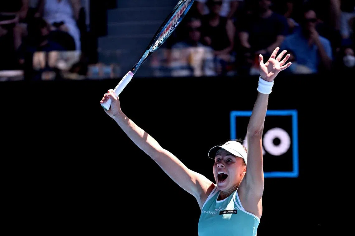 Poland's Magda Linette celebrates victory against France's Caroline Garcia after their women's singles match at the Australian Open.
