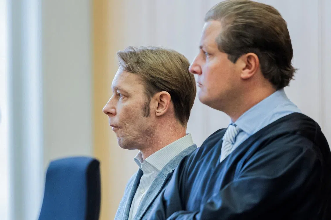 A man, who is a suspect in the disappearance of British toddler Madeleine McCann in Portugal, and his lawyer Friedrich Fuelscher wait for the verdict in a trial on unrelated sexual assault charges in Braunschweig, Germany, October 8, 2024.     Michael Matthey/Pool via REUTERS