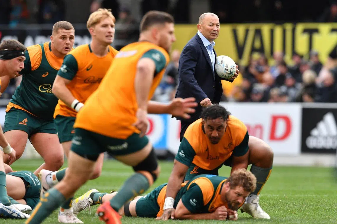 Australia coach Eddie Jones (in suit) is winless from four tests in his second stint coaching the Wallabies.
