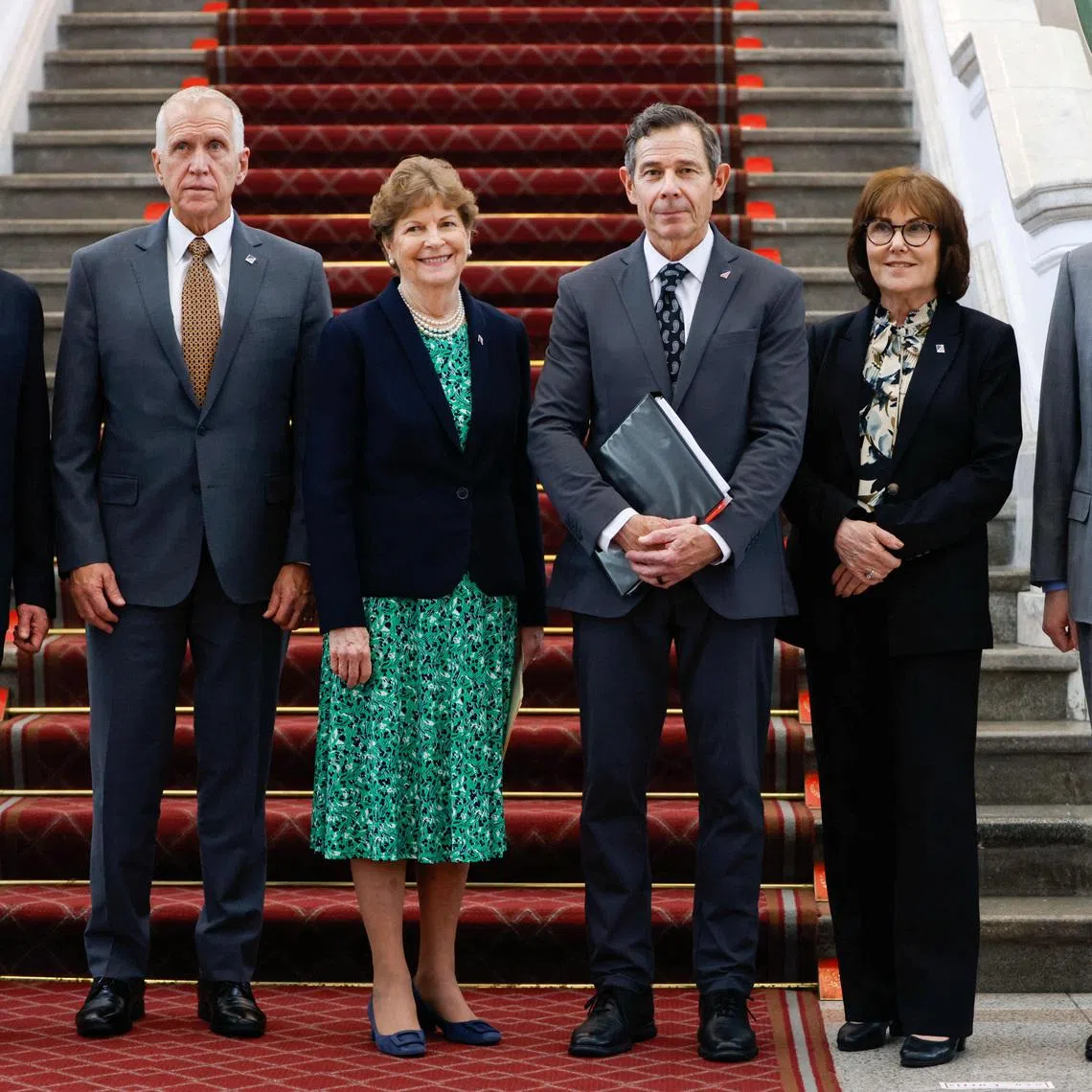 Taiwan's National Security Council Secretary-General Joseph Wu and the US delegation pose with Director of the American Institute in Taiwan Raymond Greene as they attend a press conference at the Presidential Office Building in Taipei, Taiwan, on March 30, 2026.