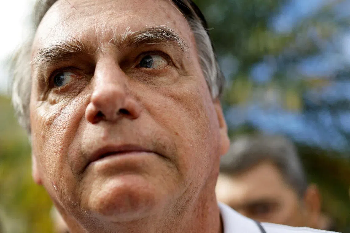 FILE PHOTO: Former Brazilian President Jair Bolsonaro looks on as he arrives for a state meeting of the Liberal Party, in Goiania, Brazil, April 4, 2024. REUTERS/Ueslei Marcelino/File Photo