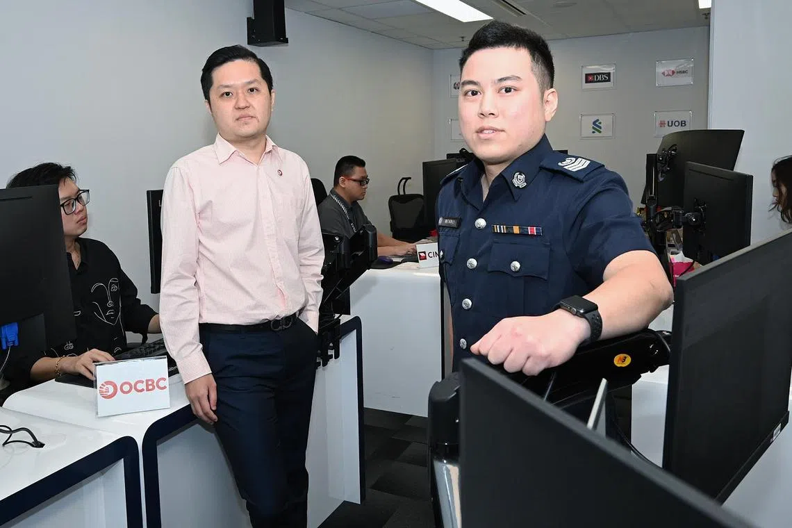Standing from left: OCBC anti-scam unit investigator Mr POH LEONG HUI and  Senior Investigating  officer Matthew Li inside Anti-Scam Command on  Nov 28 , 2024 .
Victim scammed of $1.19 million in a government official scam. Police said the victim was overseas when she received a call from scammers claiming to be from OCBC and police. She was convinced to transfer her money to multiple scam accounts thinking she was clearing money laundering allegations against her.