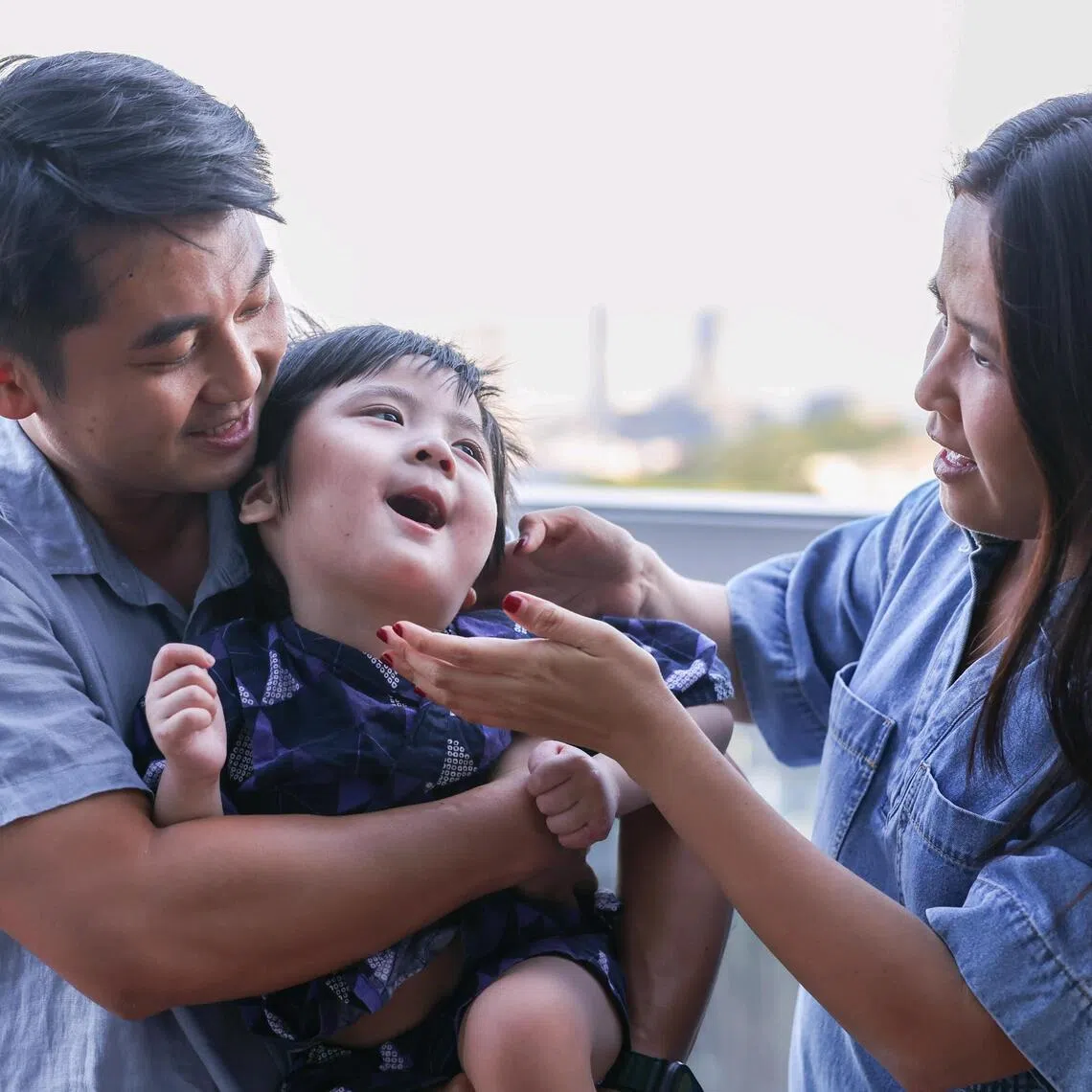 Little Oliver Soh began having seizures and showed signs of developmental delay within months of his birth. The toddler, seen here with his father, Keltonn Soh, and mother, Leow Kai Wen, has primary coenzyme Q10 deficiency.