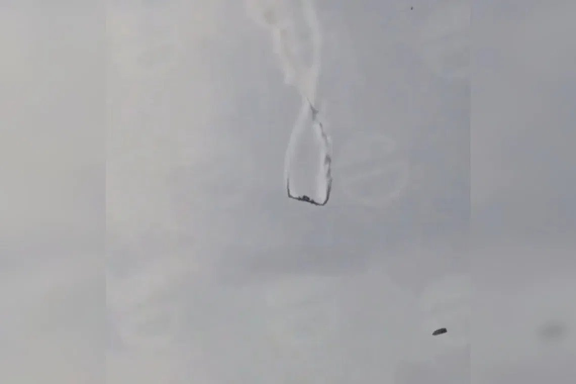 A screenshot from an online video that is said to show the plane falling to the ground.