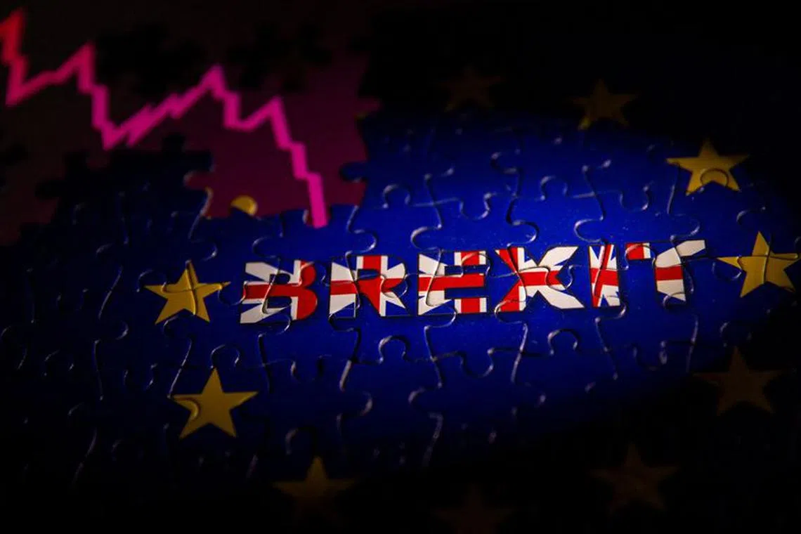Puzzle with printed EU flag and BREXIT words is placed on displayed stock graph in this illustration taken, November 8, 2021. REUTERS/Dado Ruvic/Illustration/ File photo