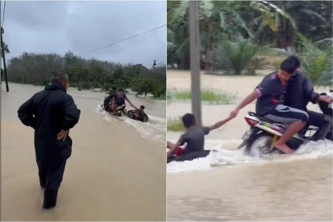 Dr Azman waded through ankle-deep flood water and smiling as he watched two youths on a motorcycle towing a boy.