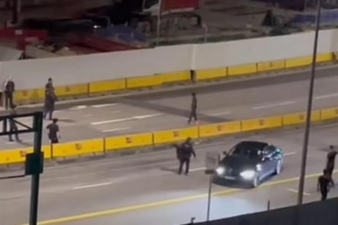 Police were seen confronting the boy in the middle of a busy road on June 9.