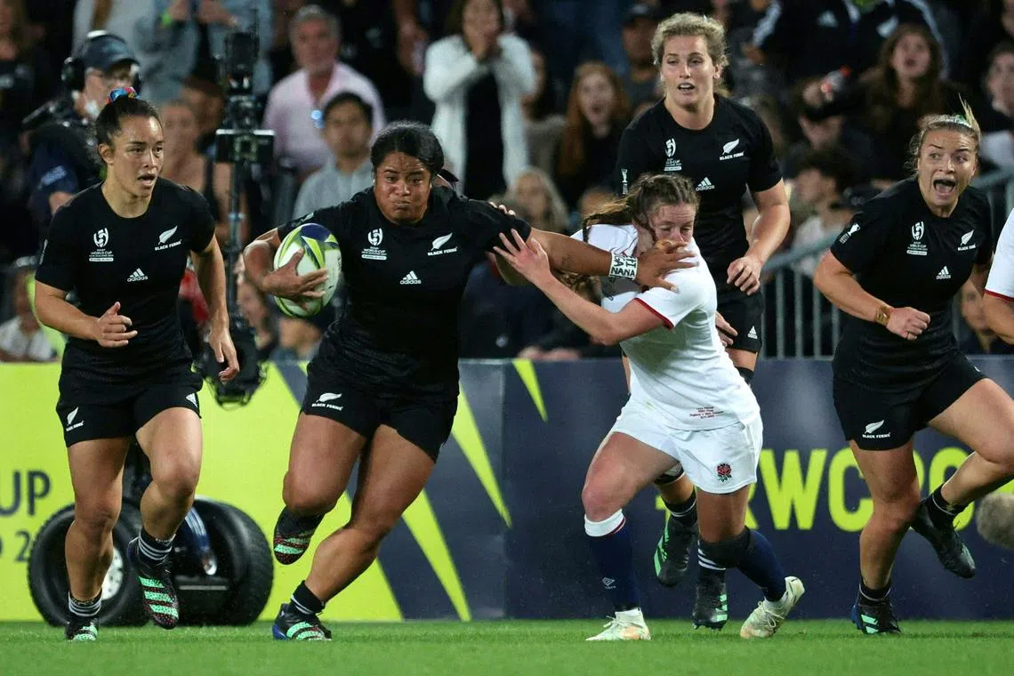 New Zealand's Ayesha Leti-I'iga fends off England's Lucy Packer during the Women’s Rugby World Cup final at Eden Park in Auckland on Nov 12, 2022. 