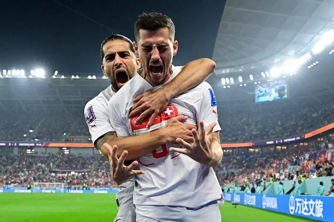 Switzerland's Remo Freuler (front) celebrates with defender Ricardo Rodriguez after scoring his team's third goal.