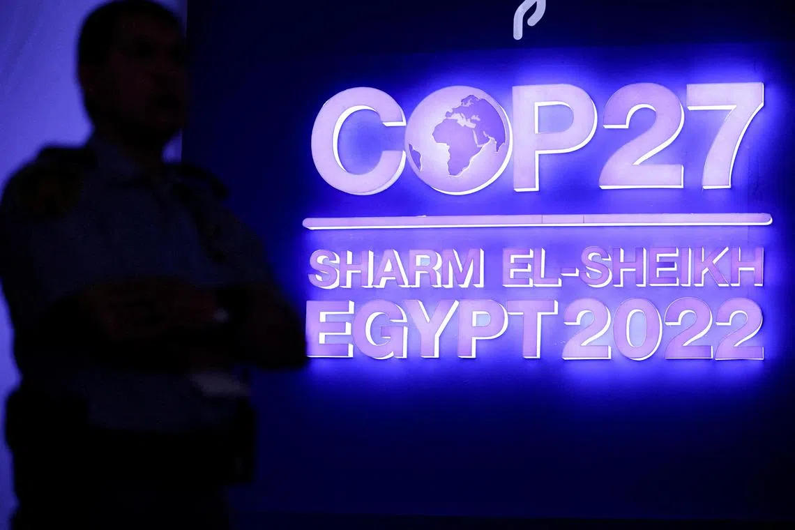 FILE PHOTO: A security personnel stands guard next to the COP27 sign during the closing plenary at the COP27 climate summit in Red Sea resort of Sharm el-Sheikh, Egypt, November 20, 2022. REUTERS/Mohamed Abd El Ghany/File Photo