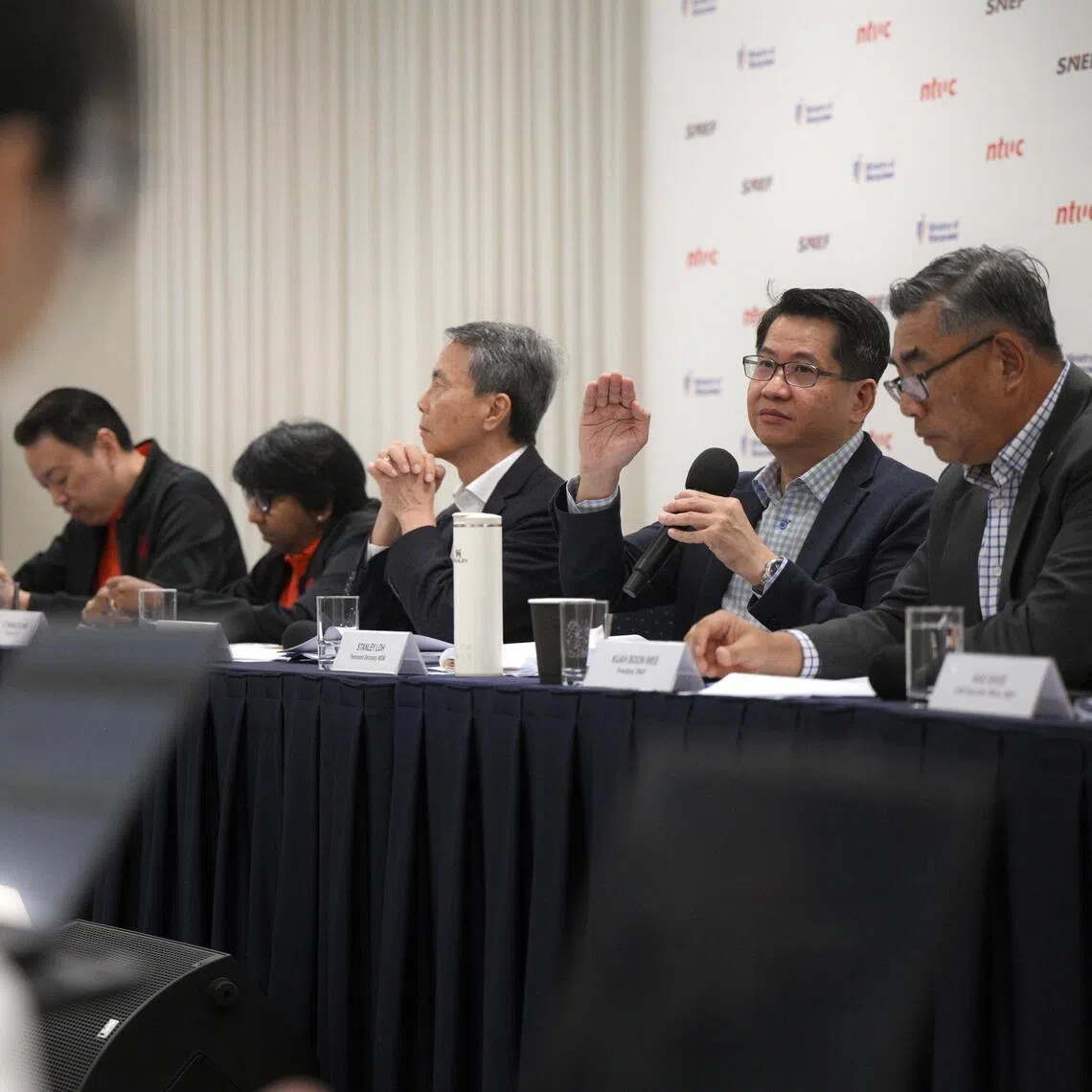 (From left) NTUC assistant secretary-general Melvin Yong, NTUC president K Thanaletchimi, National Wages Council chairman Hsieh Fu Hua, MOM permanent secretary Stanley Loh and SNEF president Kuah Boon Wee at a press conference on Oct 19.