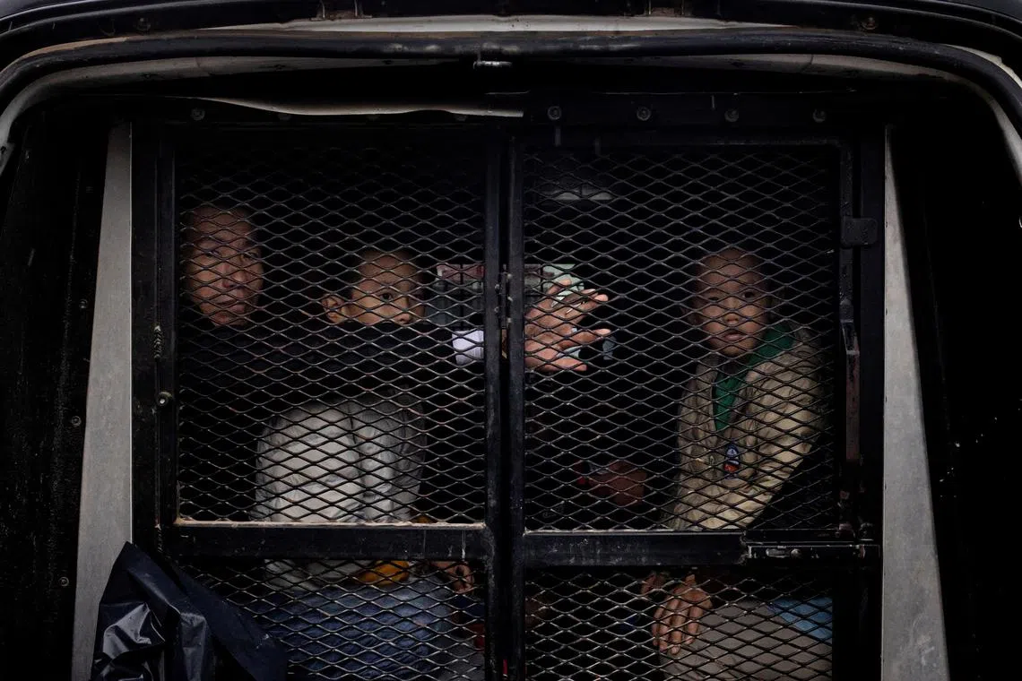 FILE PHOTO: A family of migrants from China, who wished to stay unidentified, sit in a transportation vehicle after surrendering to Border Patrol agents in Fronton, Texas, U.S., April 7, 2023. REUTERS/Staff