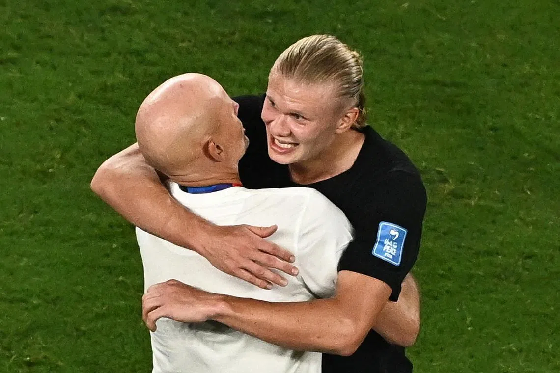Norway coach Stale Solbakken and Erling Haaland celebrate after the match.