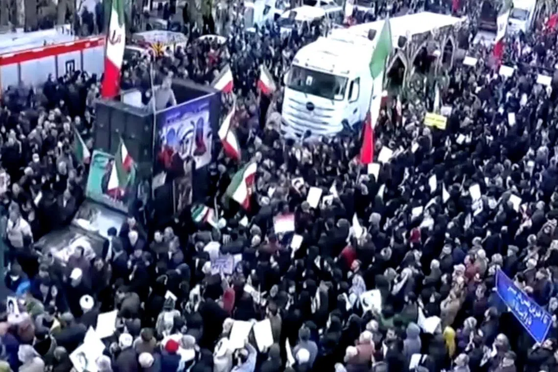 People attend a funeral procession, held by the Iranian government, for those said to be killed in recent protests, in Tehran, Iran, in this still image taken from a video released on January 14, 2026. IRAN PRESS/Handout via REUTERS