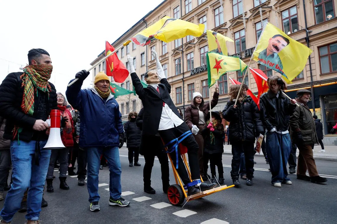 People march against Turkish President Recep Tayyip Erdogan and Sweden's Nato bid, in Stockholm.