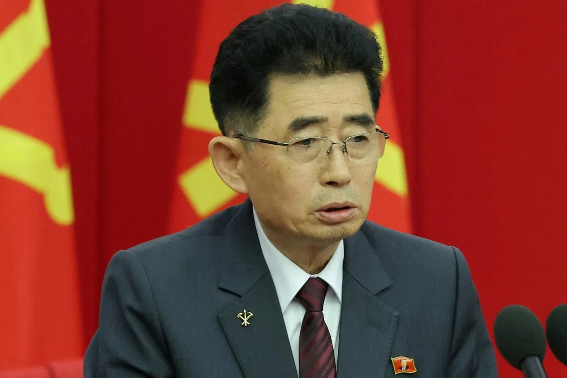 A North Korean official is seen wearing a pin featuring the portrait of North Korean leader Kim Jong-un during a key meeting of the country's ruling party in Pyongyang, North Korea, June 28, 2024 in this photo released by the North's official Korean Central News Agency.    KCNA via REUTERS
