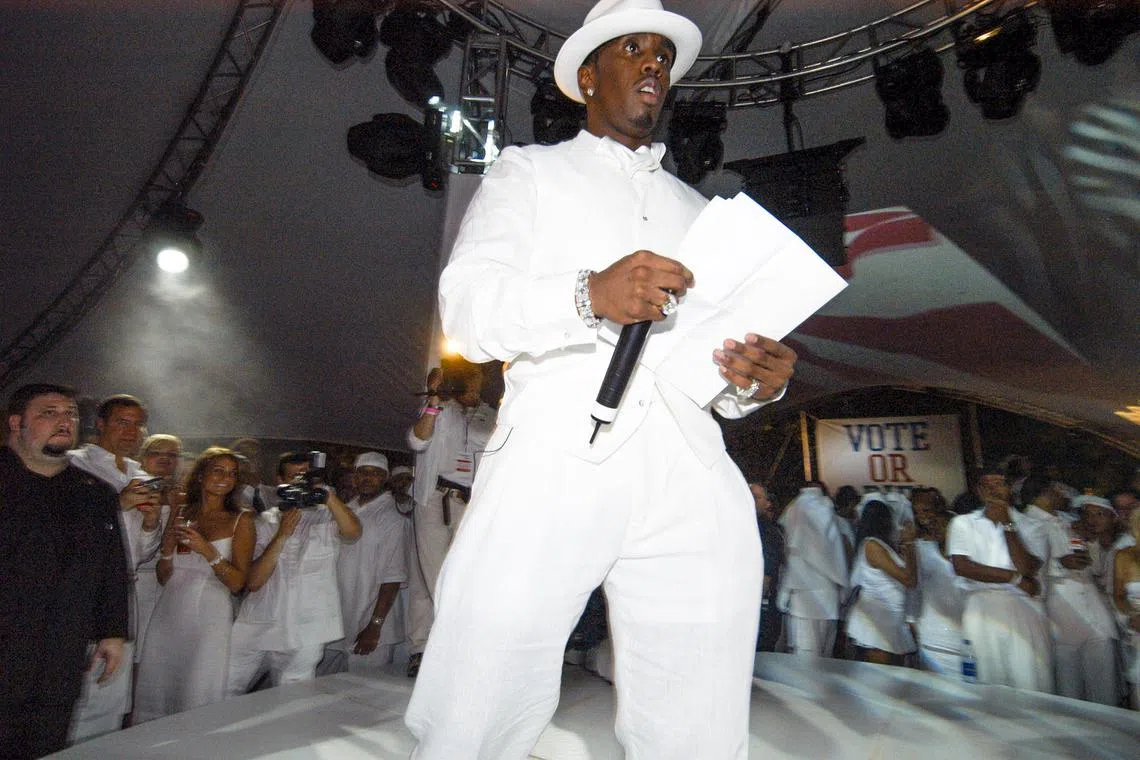 FILE ÑSean Combs, known as Diddy, hosts a White Party in New York, on June 4, 2004. The events helped the music mogul raise his profile, but one woman who worked at them has said in court papers that the parties had a dark side, too. (Maxine Hicks/The New York Times)