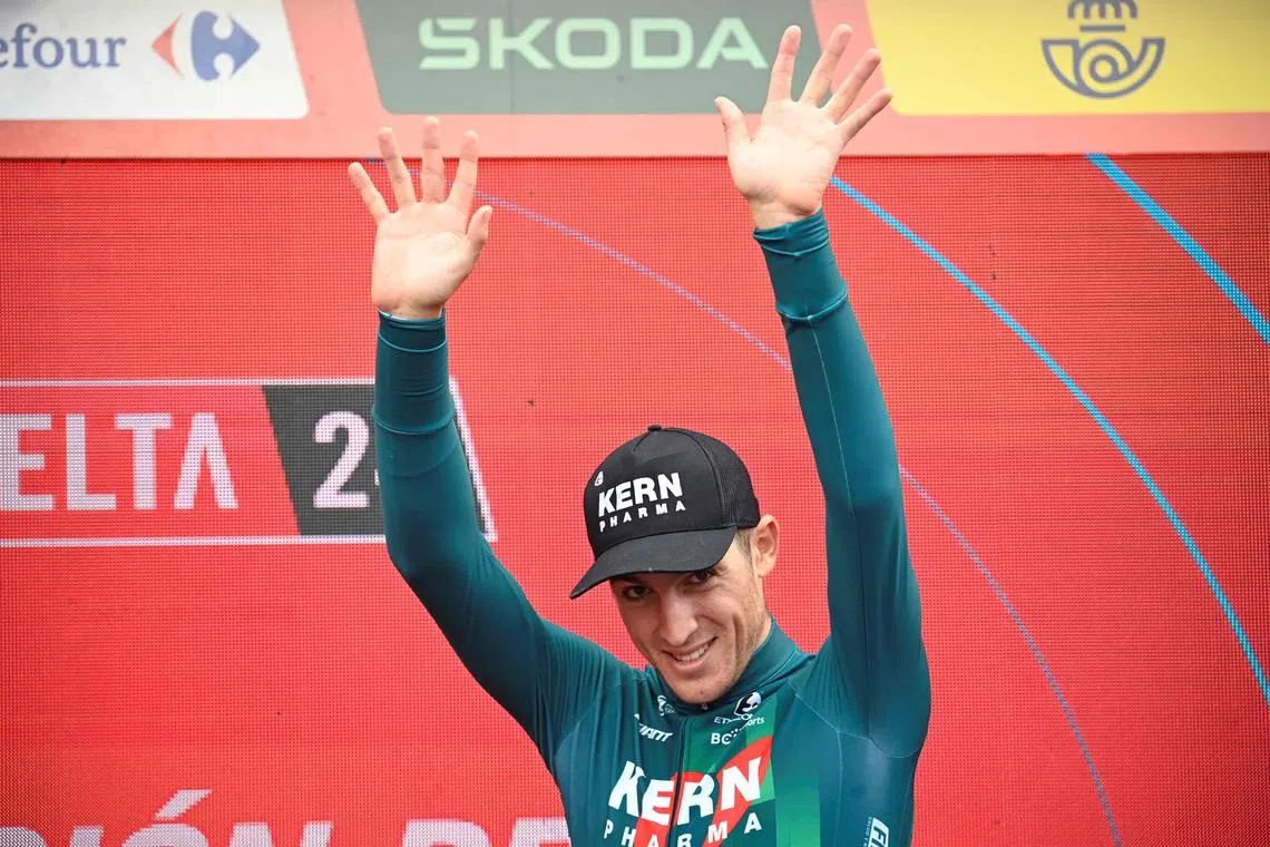 Team Kern Pharma's Pablo Castrillo Zapater celebrates on the podium after winning stage 12 of the Vuelta a Espana, a 137.5 km ride from Ourense Termal to Estacion de montana de Manzaneda, on Aug 29, 2024.