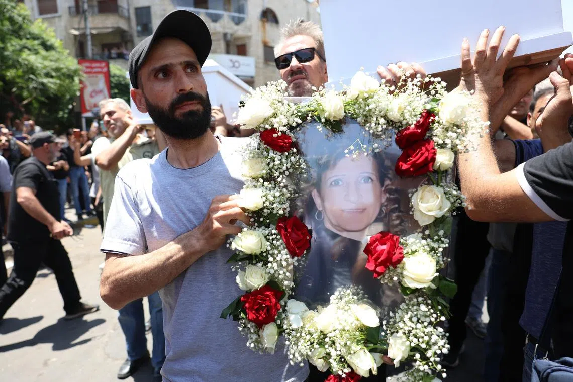 Syrian Christians mourn victims of the St Elias church bombing in the capital, Damascus, on June 24.